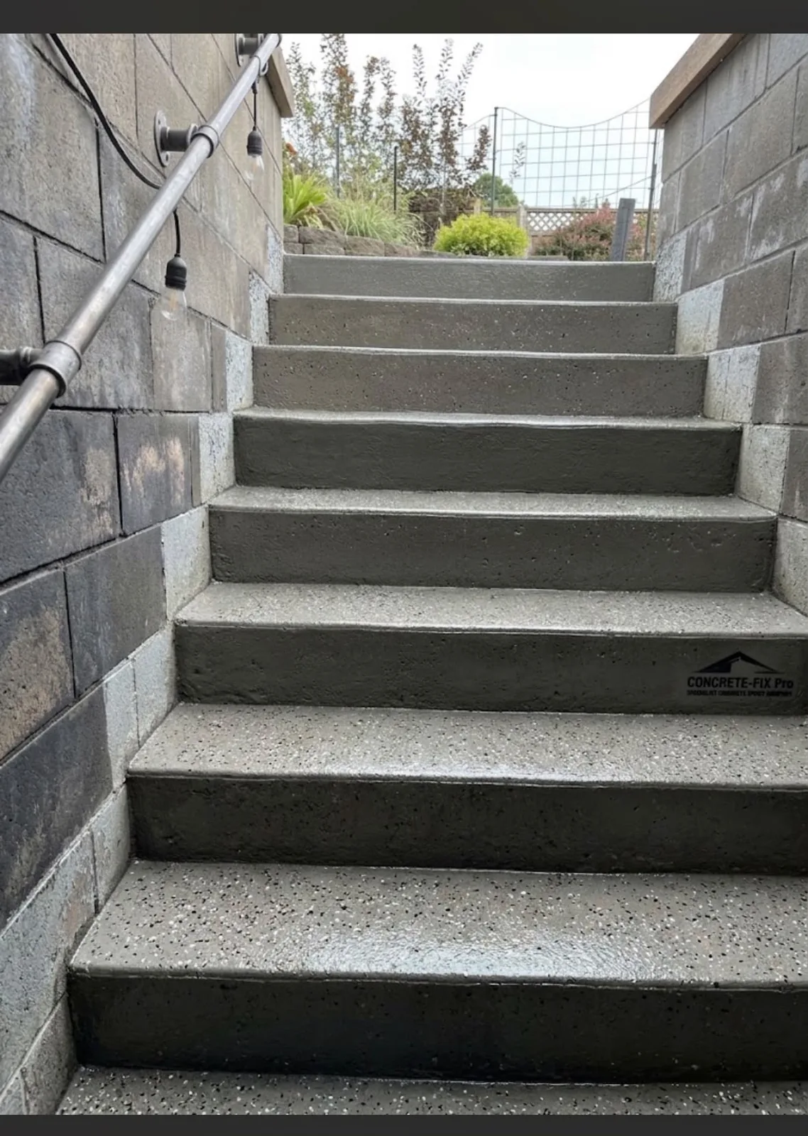 Exterior concrete stairs in Waterloo after work with an even grey textured surface and a visible Concrete-Fix Pro watermark