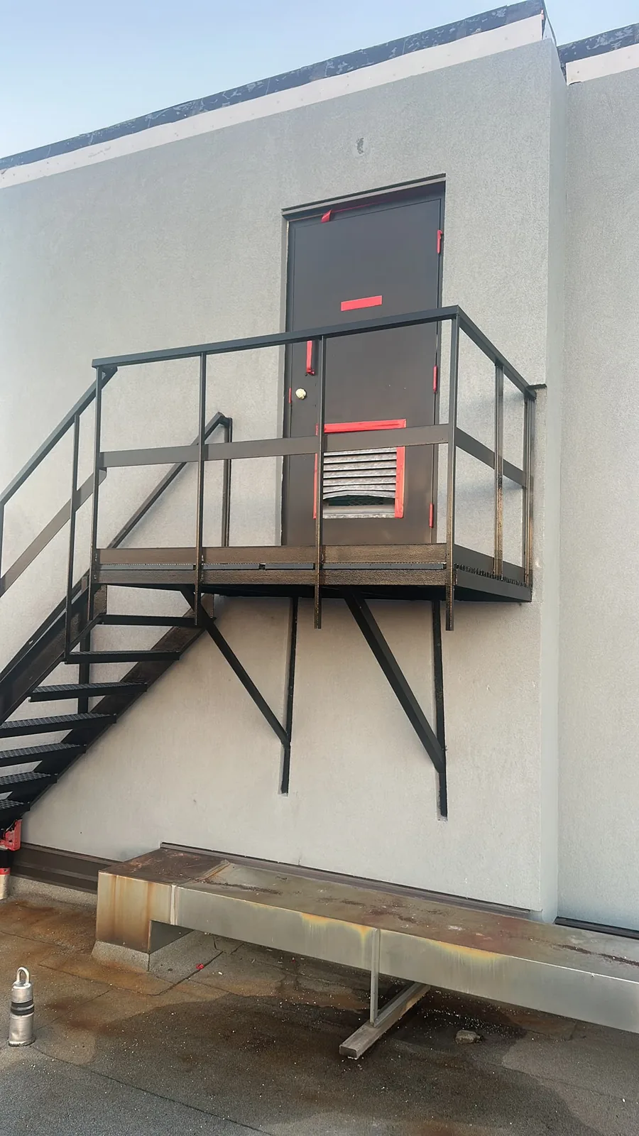 Exterior metal stairs, railings and supports in Kitchener after black paint was applied