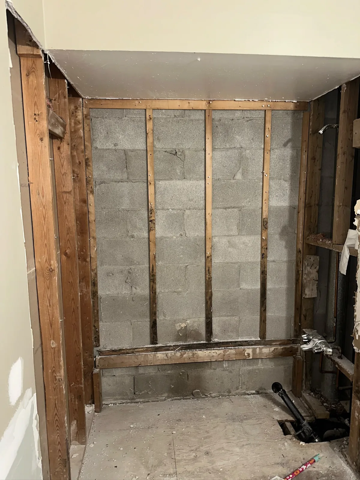 Drywall project in Waterloo with wall framing and masonry exposed during renovation work