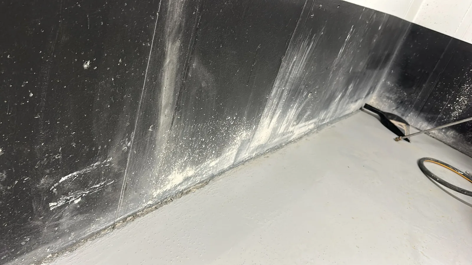 Close view of a worn commercial wall in Cambridge before painting